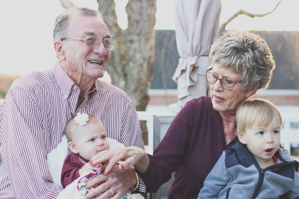 Grandparents sitting with Grandchildren