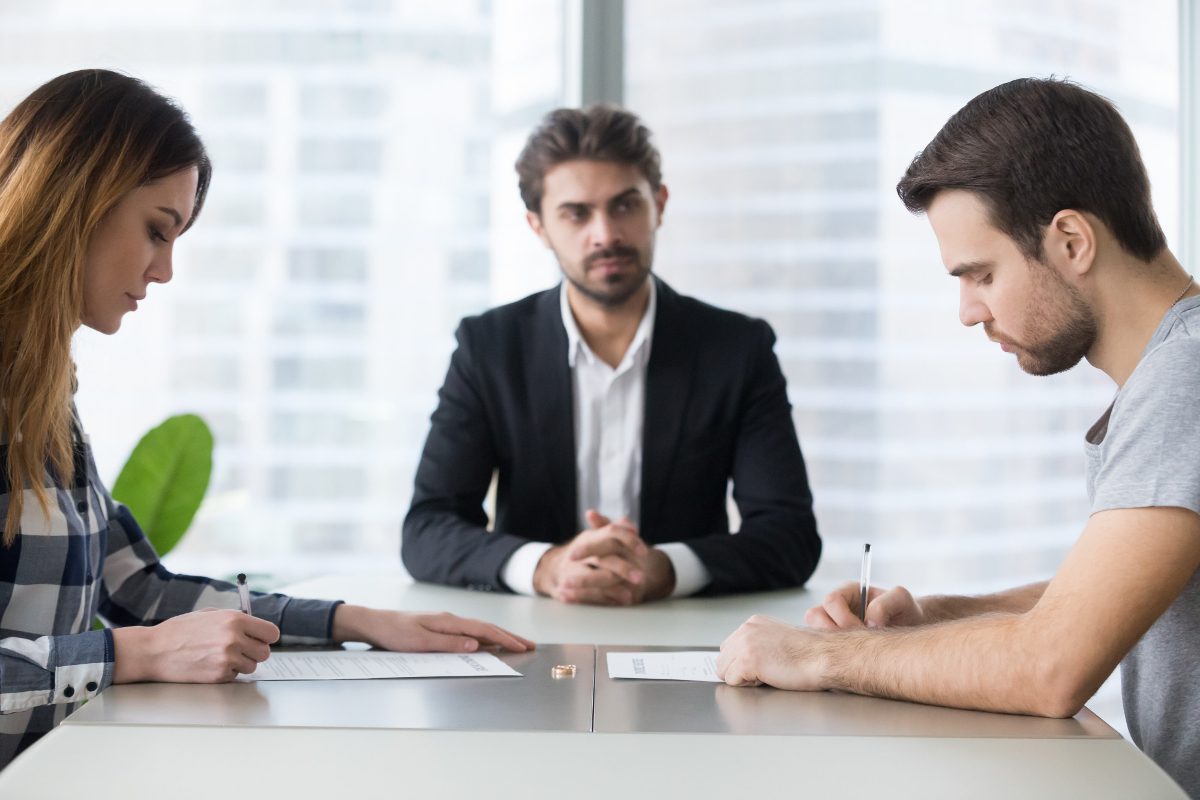 Two people meeting with a mediator